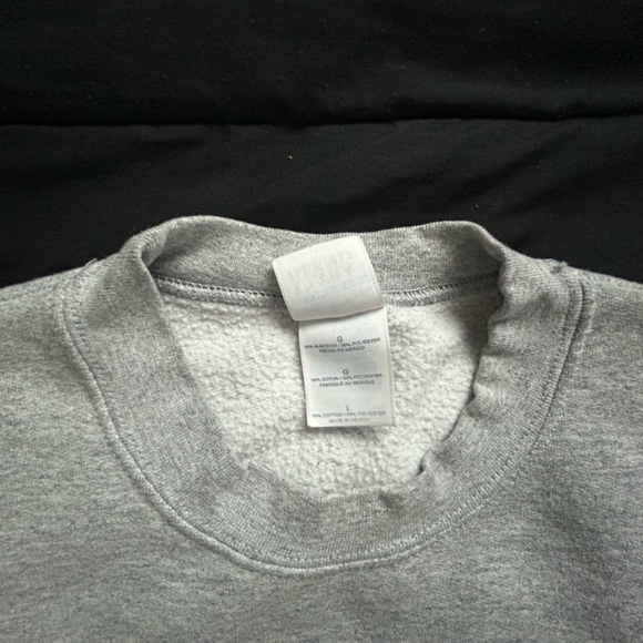 The sweater is made of a comfortable polyester and cotton blend material - Picture 2 of 2
